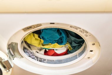 Lint trapped in filter of laundry dryer clothes machine after drying clipart