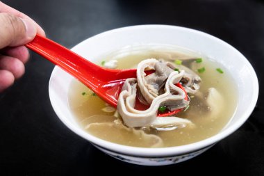 Pork stomach peppar soup, delicacy food among Chinese clipart