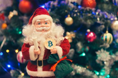 Noel Baba'nın elinde altın bitcoin