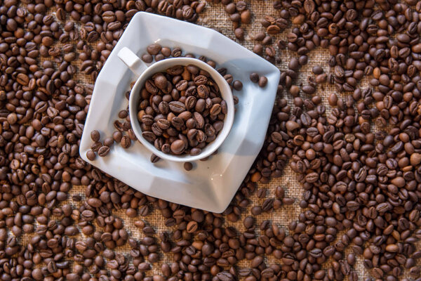Coffee beans on burlap background