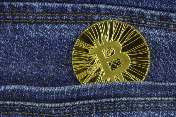 Bitcoin lies in the pocket of blue jeans