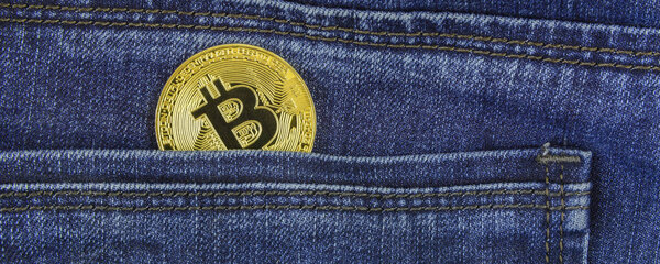 Bitcoin lies in the pocket of blue jeans
