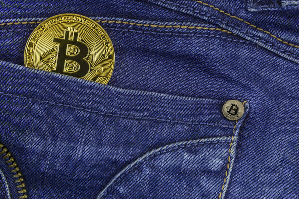 Bitcoin lies in the pocket of blue jeans