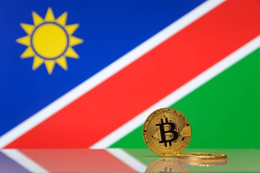  Altın bitcoin devlet bayrağı bulanık bir arka plan üzerinde duruyor