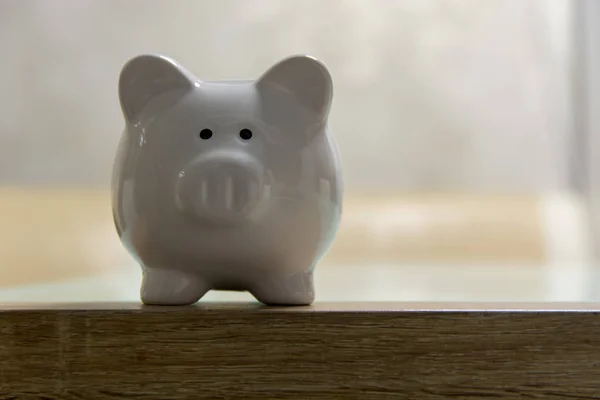 ceramic Piggy bank stand on table