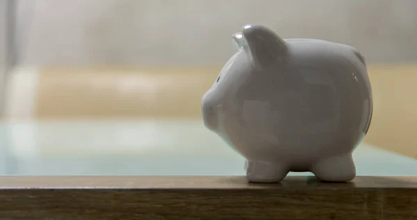 ceramic Piggy bank stand on table