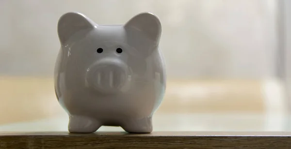 ceramic Piggy bank stand on table