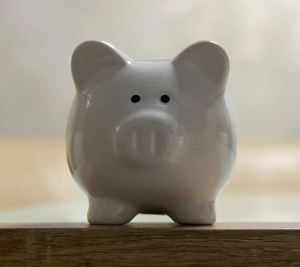 ceramic Piggy bank stand on table