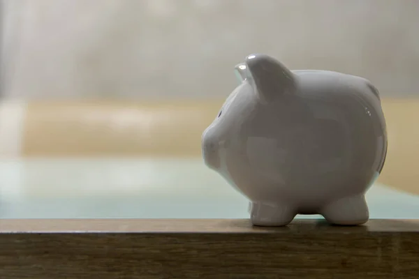 ceramic Piggy bank stand on table