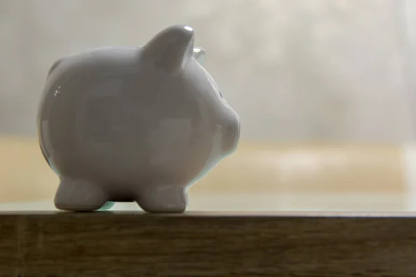 ceramic Piggy bank stand on table