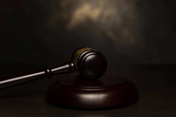 judge gavel on aged bronze background