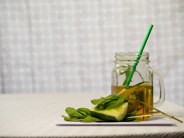Healthy cucumber mint and lime refreshing detox drink wide selective shot
