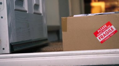 Cardboard Box of fragile goods medium panning zoom shot selective focus