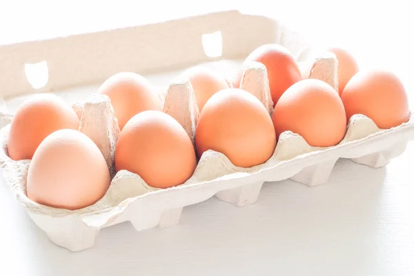 Chicken eggs in a box close-up