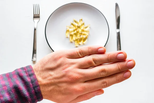 Man Refuses Fish Oil — Stock Photo, Image