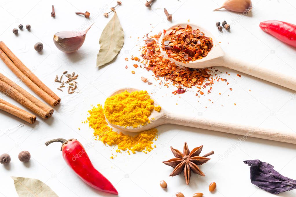 various seasonings and spices on a white background