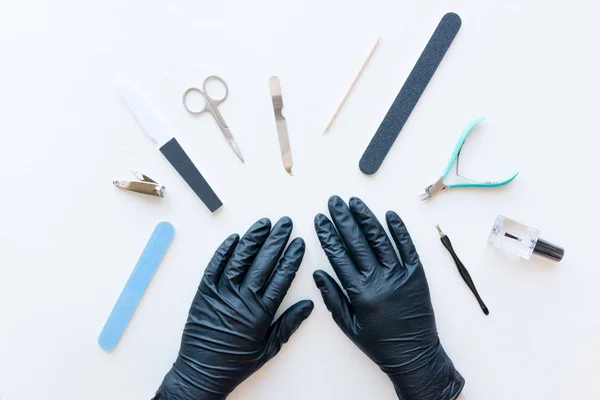 Manicure Specialist Black Gloves White Background — Stock Photo, Image