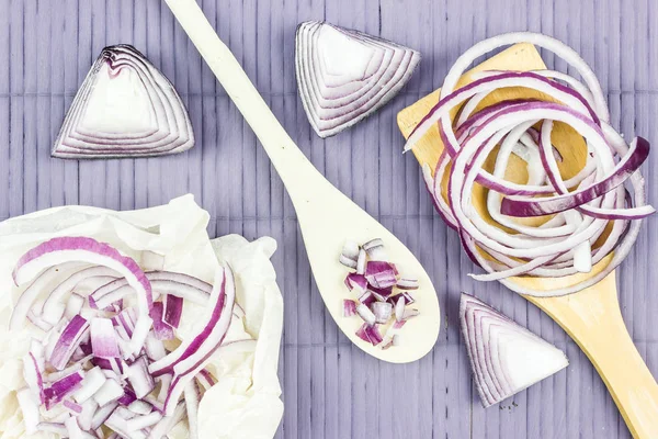 Cut in rings, slices of purple onion. Fresh red onion.