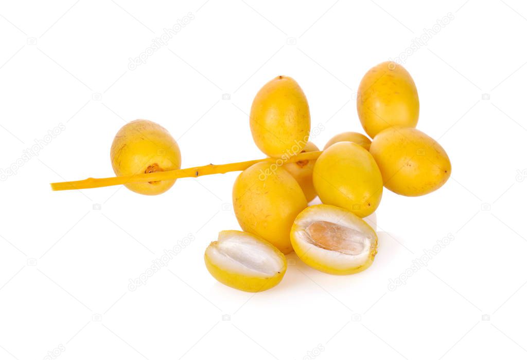 bunch of fresh yellow dates on white background