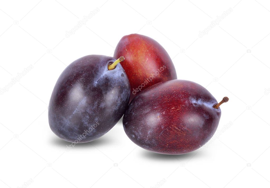 whole fresh prunes on white background