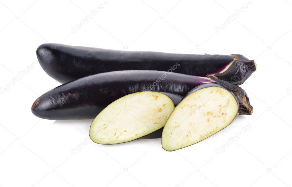 whole and sliced fresh long purple eggplant on white background