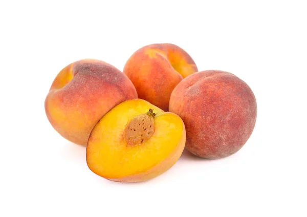 Whole and half cut ripe peach on white background — 스톡 사진