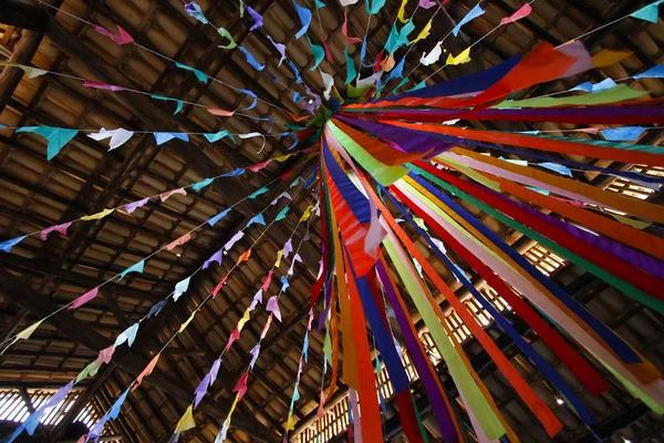 Details of decoration and colored flags suspended in decoration of June party