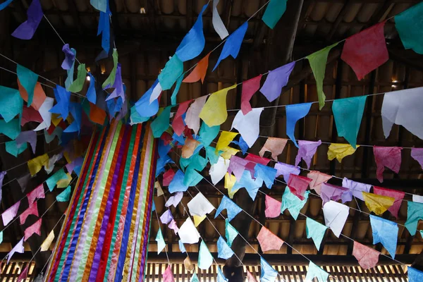 Details of decoration and colored flags suspended in decoration of June party