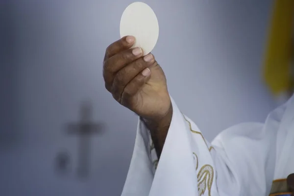 Holy communion in church. Priest celebrate mass at the church. F