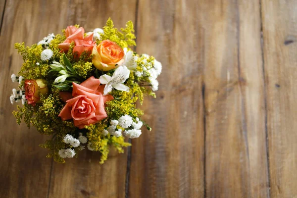 Flower arrangement with wood texture space
