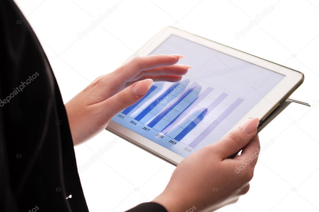 Close-up Of Young Businesswoman Looking At Graph On Digital Tablet