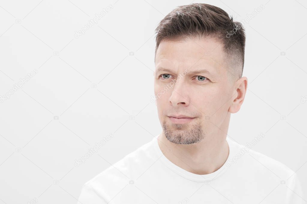 Futuristic handsome bearded brunet man 40s years in white clothes on a white background close-up. God, teacher and boss.