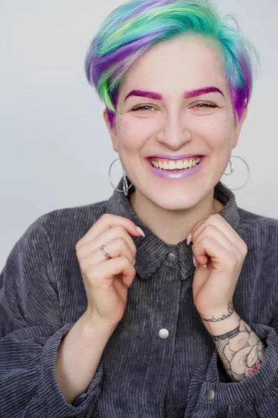 Young beautiful woman with dyed blue and green hair. Pixie bob short haircut The concept of hair styling. — Stock Photo, Image