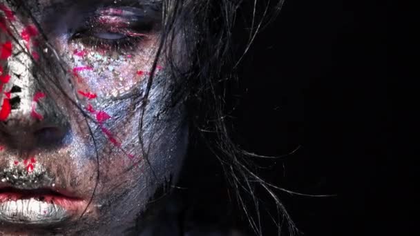 Fashion glamour portrait of beautiful young caucasian woman on black background. Bright colored creative makeup. Dramatic dark image. Effect of a dirty face with drops of blood. — Stock Video