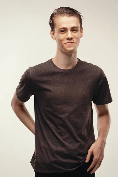 Isolated studio portrait handsome Caucasian male model. laughing at joke, he couldnt stop laughing. Funny friendly looking young boy smiling broadly, cheerful and happy. Dressed in casual t-shirt — Stock Photo, Image