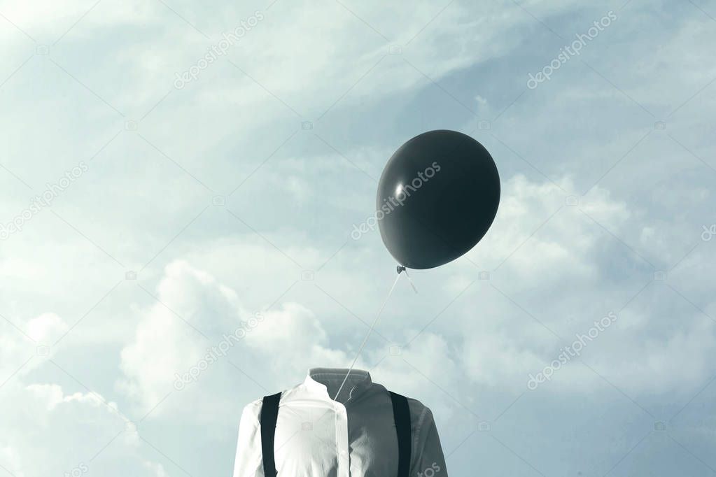 surreal concpet big black balloon blowing in the wind
