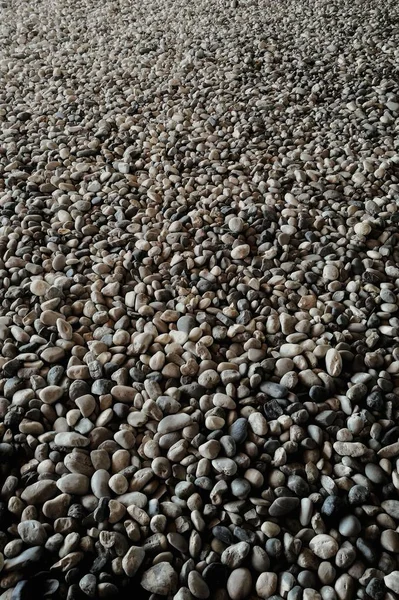 gravel on ground construction material for reference. ground and sub base layer of floor. river stone smooth curve edge stone.
