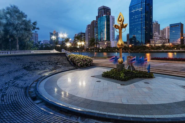 Bangkok Thailand Aug 15, 2014: golden modern abstract lotus sculpture in an circular space. a luxury art in Benjakitti public green park in center of Bangkok.