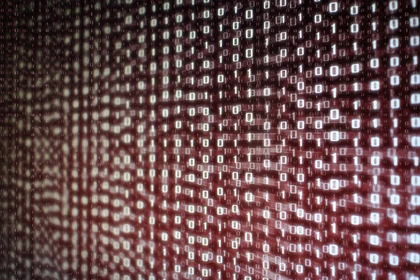 computer data matrix. vertical digital binary code moving motion downward. light up red one and zero text flowing down. black background space with multiple layers coding.