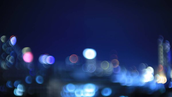 Blur city sky night light. bokeh defocus light from building in a metropolis. business and city life concepts background.