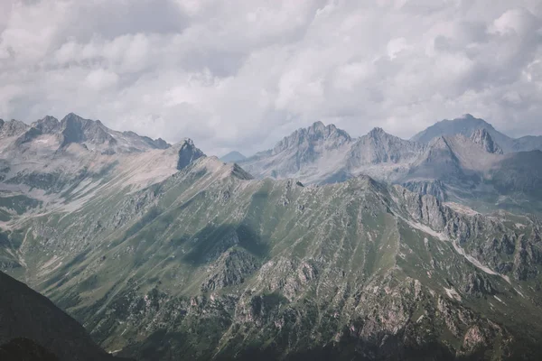 Panorama of mountains scene with dramatic cloudy sky in national