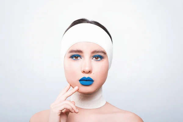 Beauty concept. Young model with blue lips and soft skin prepari — Stock Photo, Image