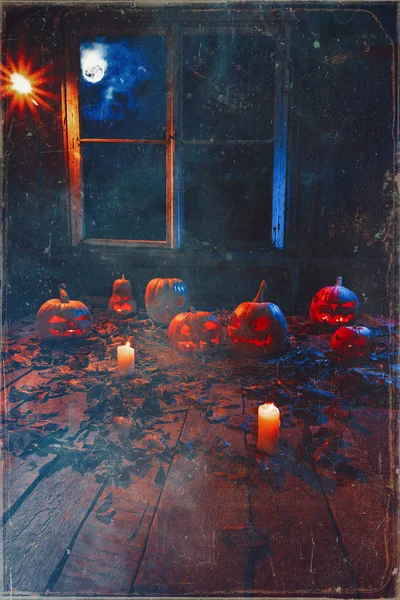 The concept of Halloween. A lot of luminous evil scary pumpkins,