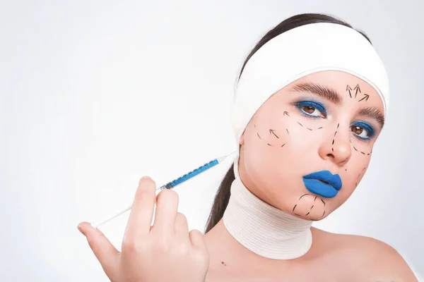 Beauty concept. Young model with blue lips and soft skin doing p — Stock Photo, Image