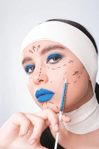 Beauty concept. Young model with blue lips and soft skin doing p — Stock Photo, Image