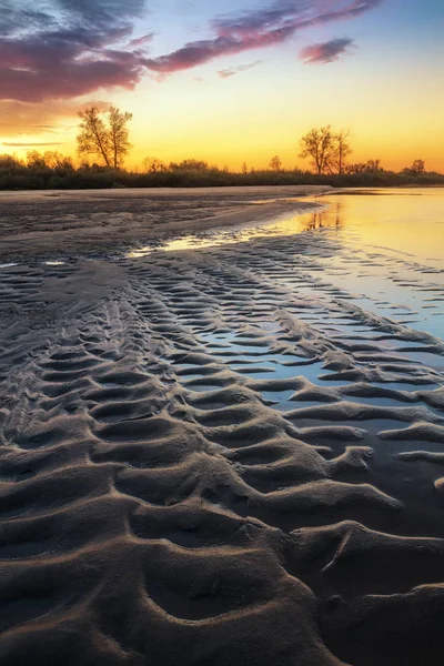 Beautiful sandy river bank at sunset — Stock Photo, Image