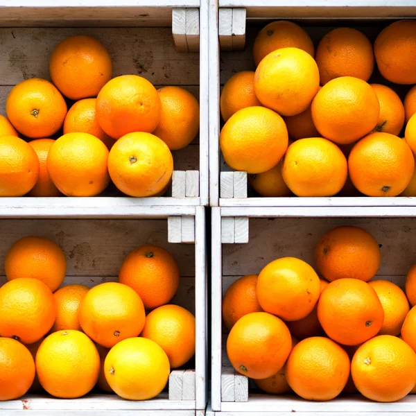 Oranges in white wooden boxes.Eye bird view.