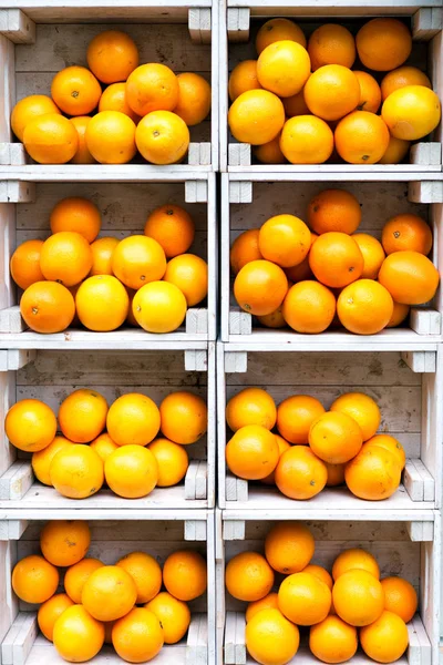 Oranges in white wooden boxes.Eye bird view.