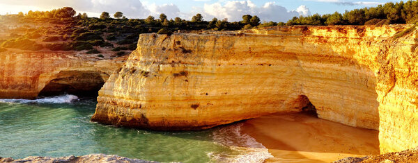 Panoramic view of the rock formations. Praia de Marinha, Caramujeira, Lagoa, Algarve, Portugal.
