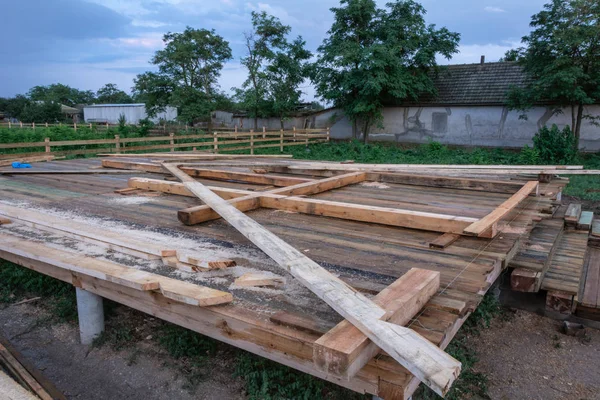 Wooden support beams and a template of the frame of the house A-frame type